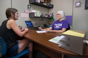Student talking with an academic advisor